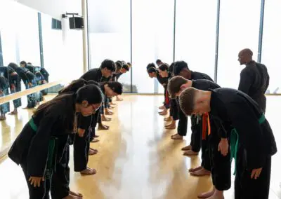 Image of a group of students bowing