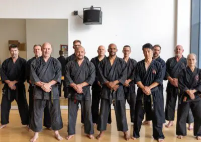 Adults standing in karate class