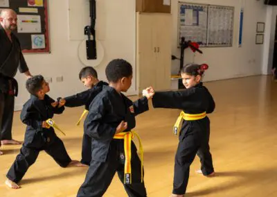 Kids practising in karate class