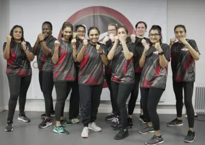 Image of women lined up in a kickboxing class