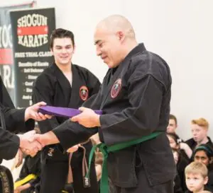 Image of a man receiving his next grading