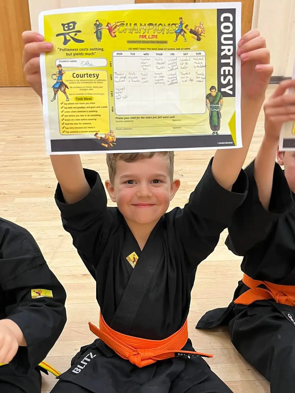 Image of a student holding up a certificate